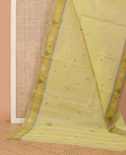 Pastel yellow buttas Bengal cotton saree, contrast temple border & pallu of stripes & buttas