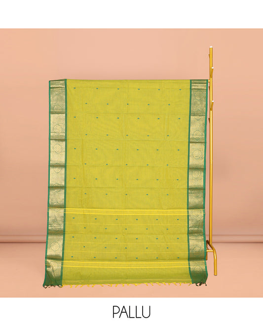 Parrot Green Chettinad Cotton Saree, Subtly Sparkled with Buttas All Over Its Body, Complemented by a Contrast Chakram Zari Design Border, Pallu of Stripes and Buttas, and Paired with a Matching Blouse