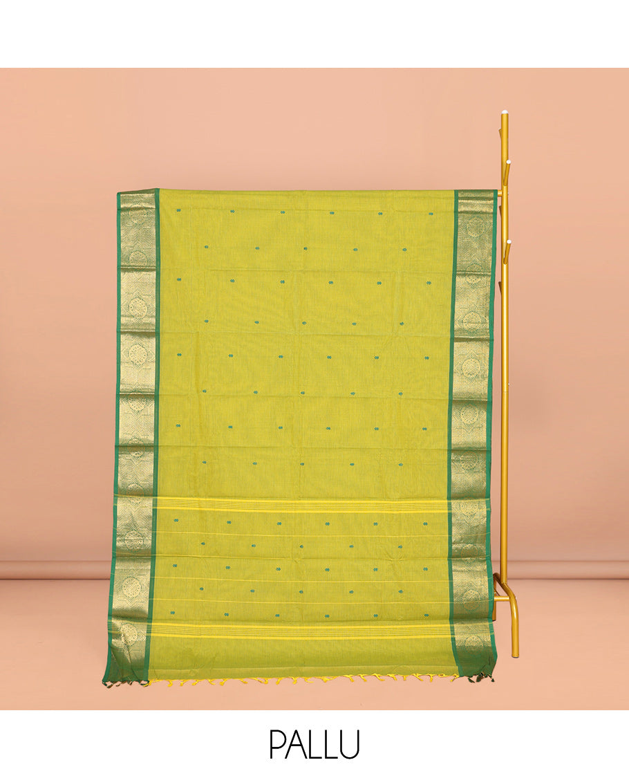 Parrot Green Chettinad Cotton Saree, Subtly Sparkled with Buttas All Over Its Body, Complemented by a Contrast Chakram Zari Design Border, Pallu of Stripes and Buttas, and Paired with a Matching Blouse
