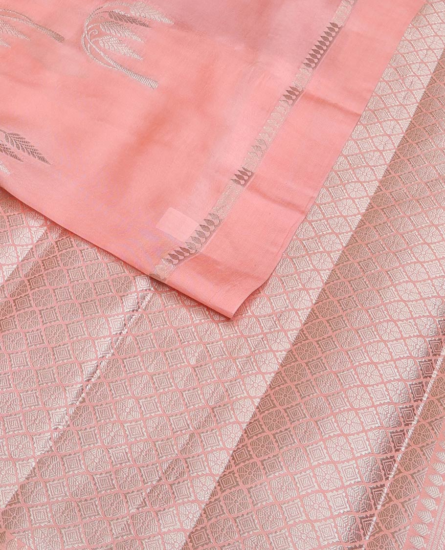 Peach floral buttas raw mango silk saree, zari border, and zari rich jaal pallu