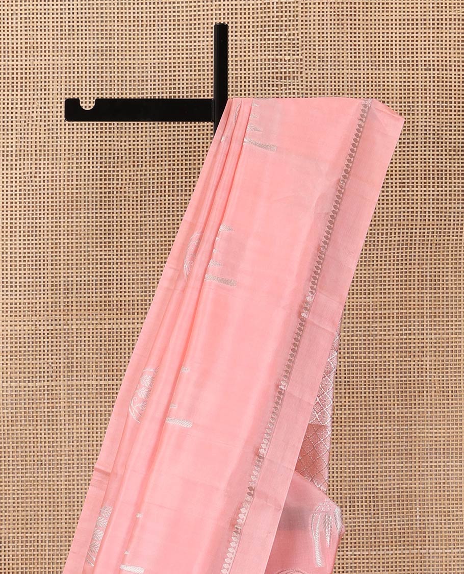 Peach floral buttas raw mango silk saree, zari border, and zari rich jaal pallu