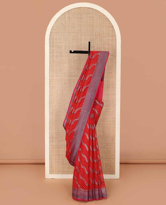 Red diagonal zig-zag floral vine woven fancy saree, zari border, and zari woven pallu