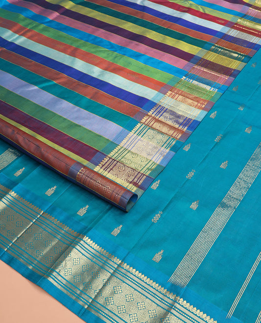 Multi-color striped Kanchipuram silk saree, one-sided zari border of thilakam mokku, banaras, muthu, and jaal designs, and zari design pallu