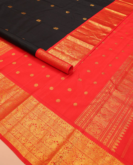 Black mayil chakram buttas Kanchipuram silk saree, contrast border of thilakam mokku, mayil, yaanai, and chakram designs, and chakram design pallu