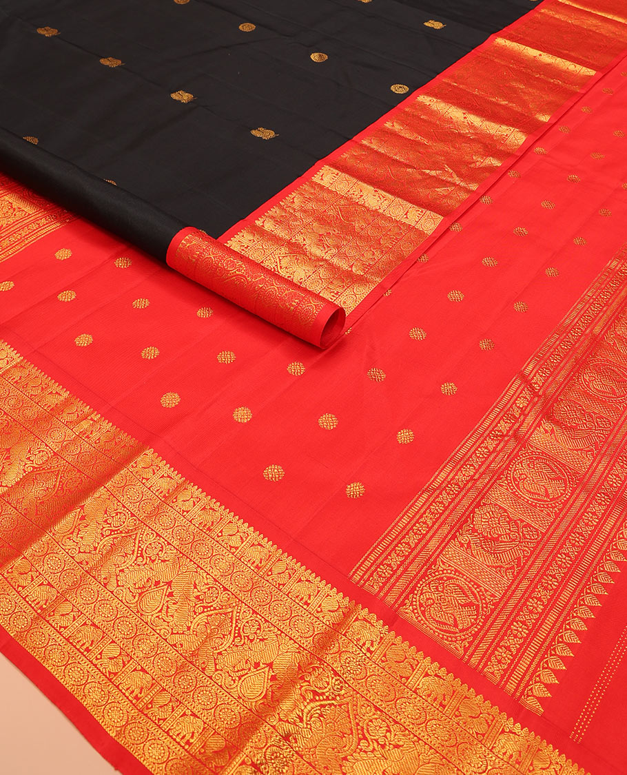 Black mayil chakram buttas Kanchipuram silk saree, contrast border of thilakam mokku, mayil, yaanai, and chakram designs, and chakram design pallu
