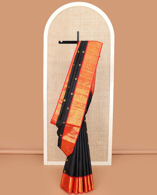 Black mayil chakram buttas Kanchipuram silk saree, contrast border of thilakam mokku, mayil, yaanai, and chakram designs, and chakram design pallu