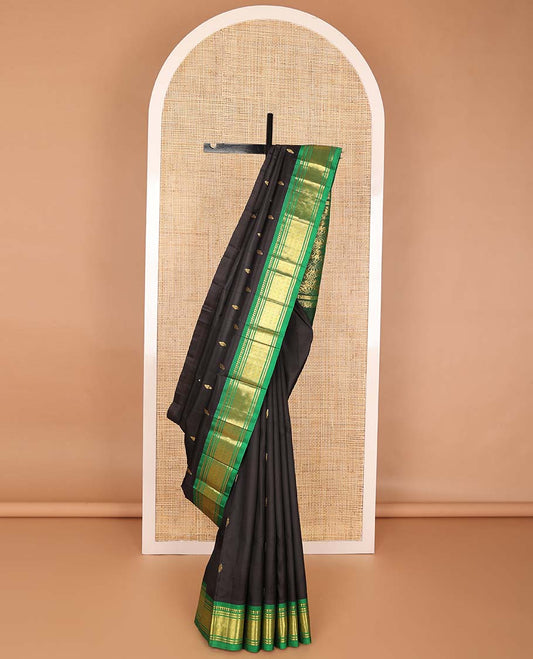 Black buttas kancheepuram silk saree with contrast border of thilakam mokku, banaras, geometric design & floral pallu