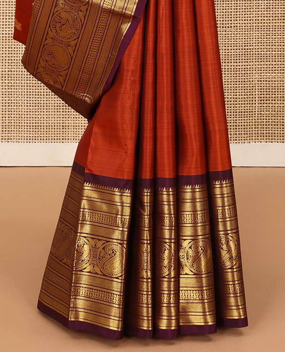 Orange annam chakram buttas Kanchipuram silk saree, contrast border of rekku, banaras, vanki, round mayil, and round manga, and jaal pallu
