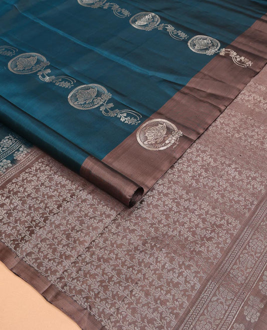 Blue Mayuri Soft Silk Saree Graced with Butterfly and Floral Buttas All Over the Body, Complemented by a Contrast Border Mirroring the Same Design, Pallu of Leaf Vine Designs, and Paired with a Contrast Blouse