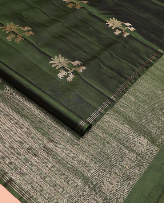 Green pichwai cow motifs soft silk saree, zari piping border, and pallu of geometric designs