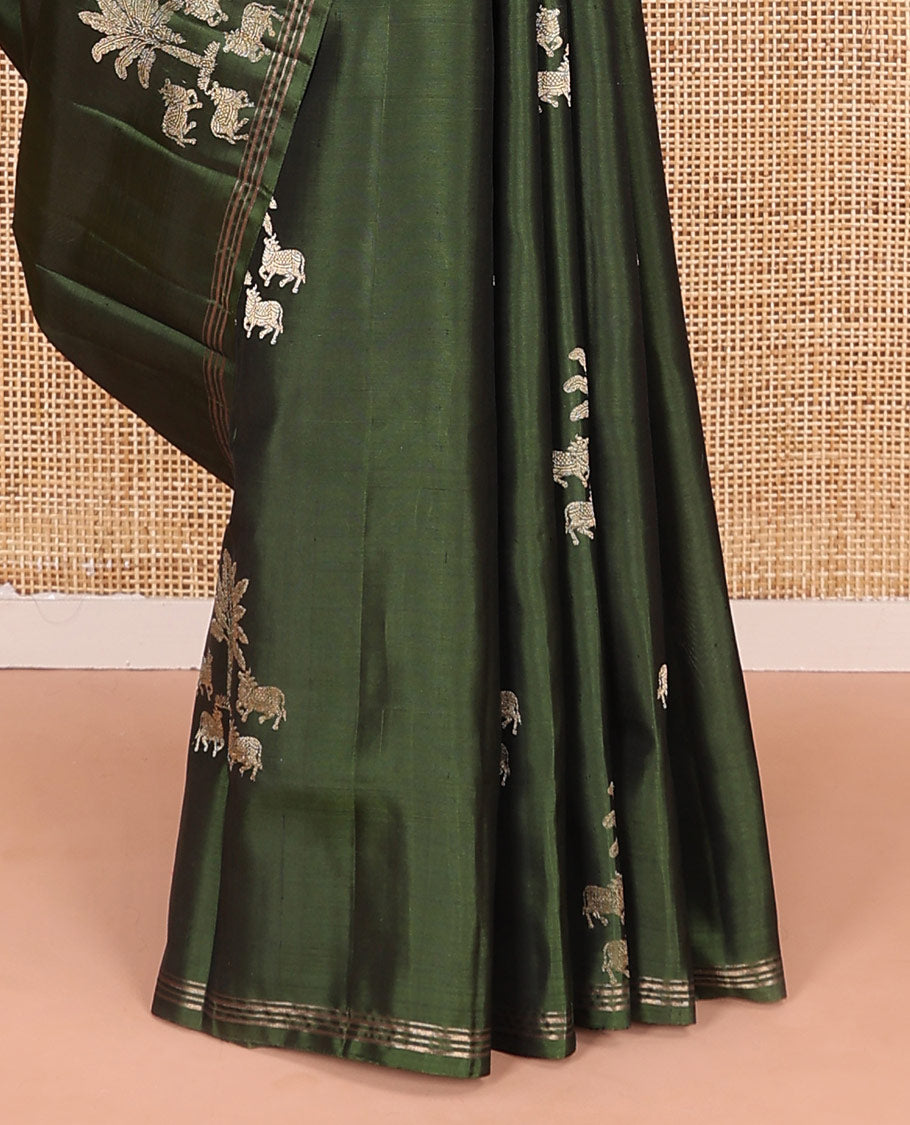 Green pichwai cow motifs soft silk saree, zari piping border, and pallu of geometric designs