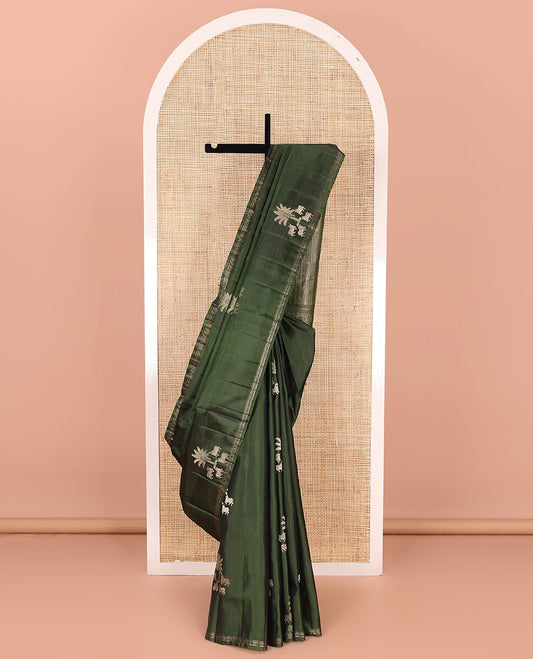 Green pichwai cow motifs soft silk saree, zari piping border, and pallu of geometric designs