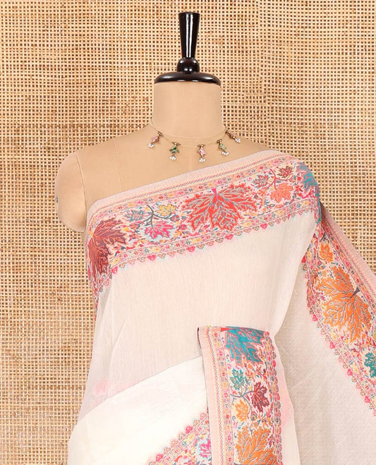 White kaleidoscopic floral motifs woven pashmina saree, kaleidoscopic floral border, Mughal style patterned pallu, and a colorful leaf jaal blouse
