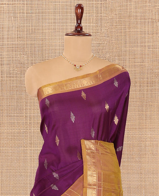 Purple Uppada Silk Saree Embellished with Zari Buttas, Complemented by a Contrast Traditional Zari Border of Zari Designs, Contrast Pallu of Floral and Paisley Designs, and Paired with a Contrast Blouse
