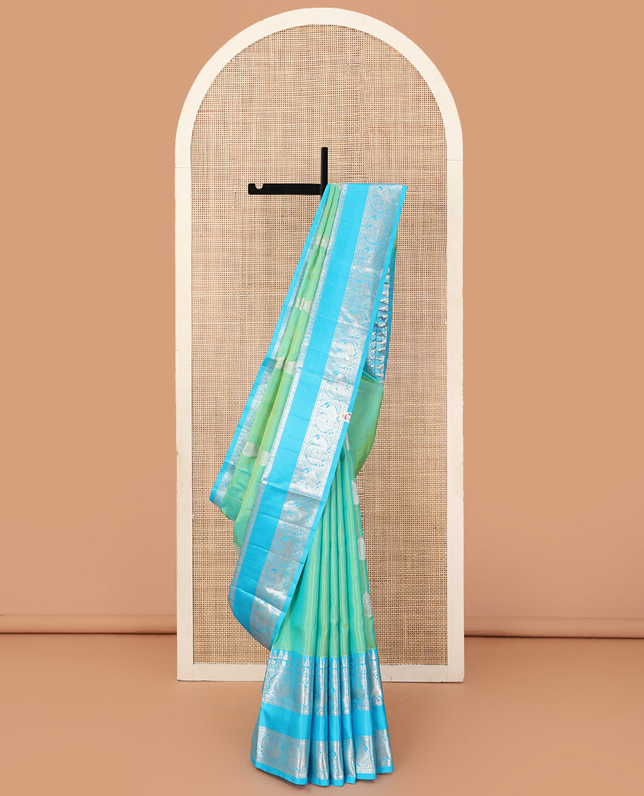 Aqua green dual-tone zari buttas Venkatagiri silk saree, contrast traditional zari rettai pettu border of peacock designs, and pallu of chakra, and rudraksham