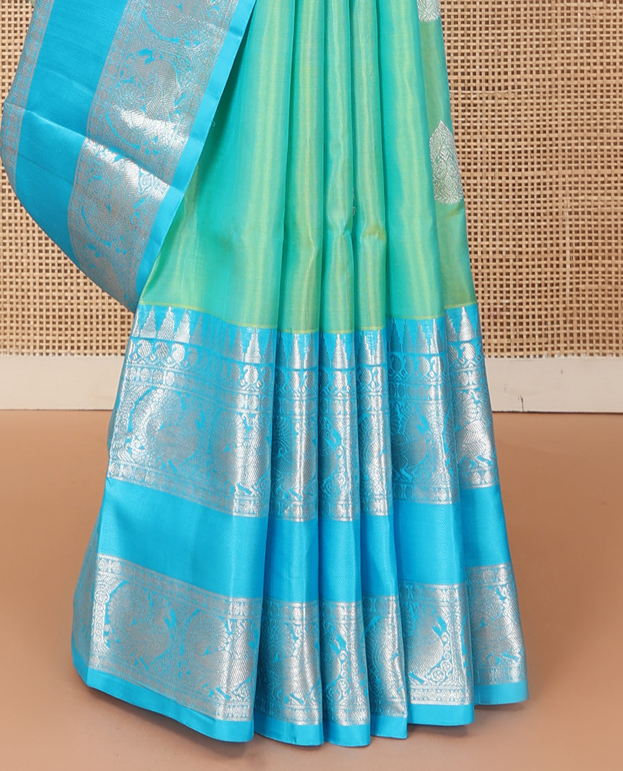 Aqua green dual-tone zari buttas Venkatagiri silk saree, contrast traditional zari rettai pettu border of peacock designs, and pallu of chakra, and rudraksham