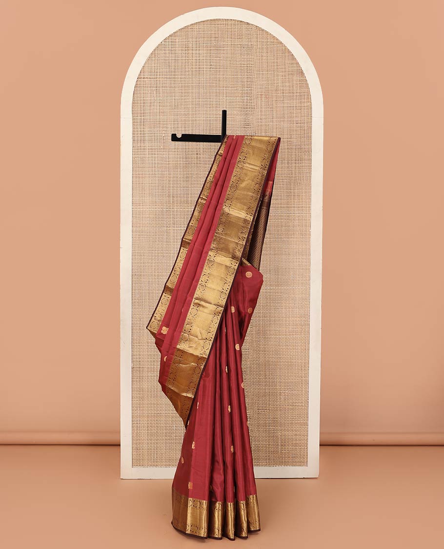 Red annam chakram buttas Vasundhara silk mix saree, contrast border of rudraksham, yaanai, mayil, chakram, vanki, mayil kann, and zari stripes, and jaal pallu