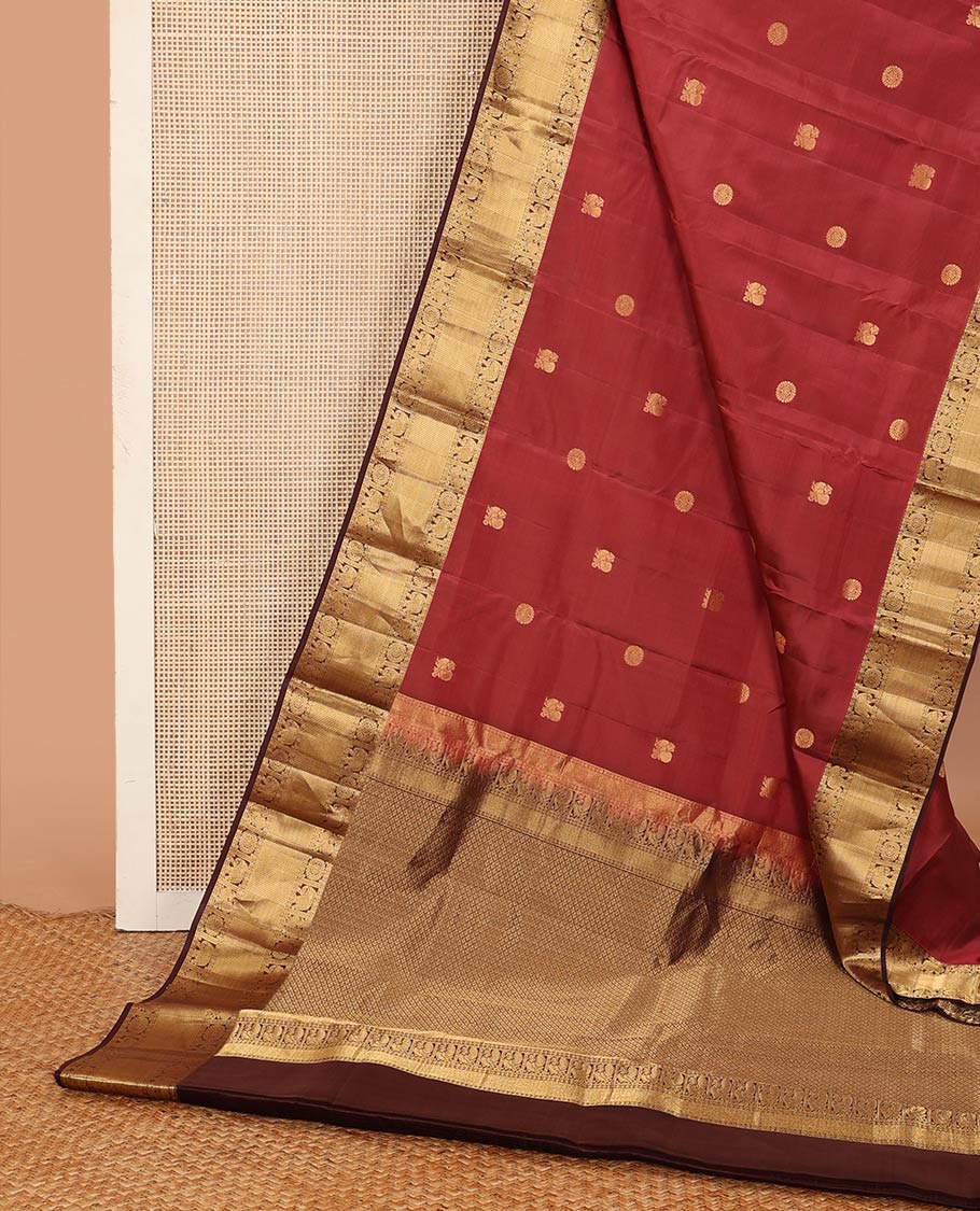 Red annam chakram buttas Vasundhara silk mix saree, contrast border of rudraksham, yaanai, mayil, chakram, vanki, mayil kann, and zari stripes, and jaal pallu
