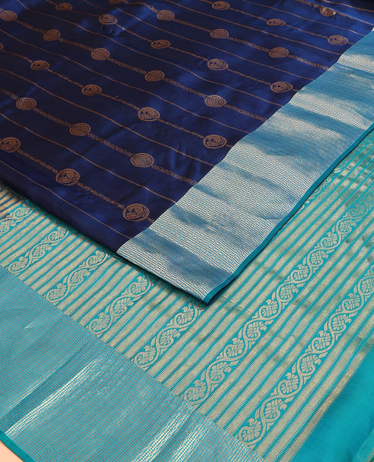 Blue Vasundhara Lite Silk Mix Saree, Elevated with Mayil-Chakram Buttas on Its Body, Complemented by a Contrast Geometric-Patterned Zari Border, Pallu Features Muthu, and Kodi Visiry Designs, and Paired with a Contrast Blouse