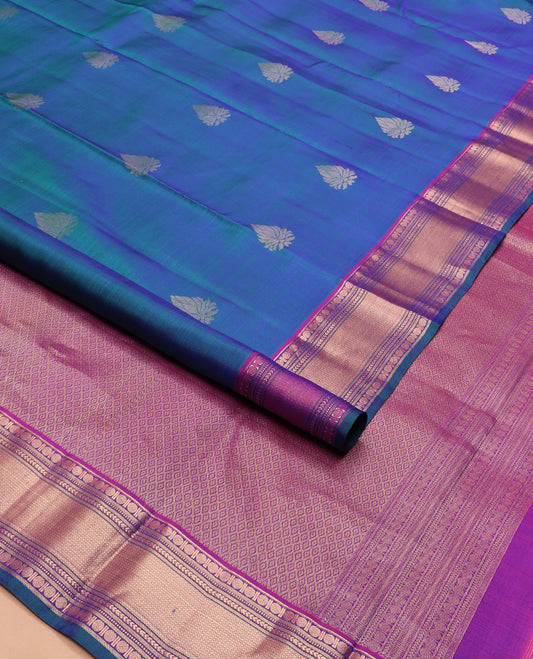 Blue zari buttas silk saree, contrast border of rudraksham, muthu, neli, kathir, and mayil kann and jaal pallu