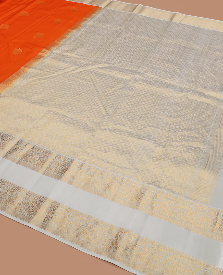 Orange zari buttas silk saree, contrast rettai pettu border of thilakam mokku, kamalam, and mayil designs, and jaal pallu