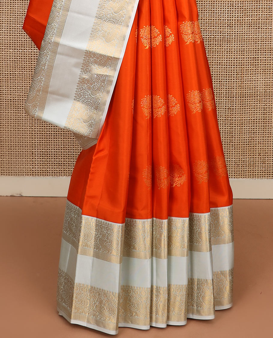 Orange zari buttas silk saree, contrast rettai pettu border of thilakam mokku, kamalam, and mayil designs, and jaal pallu