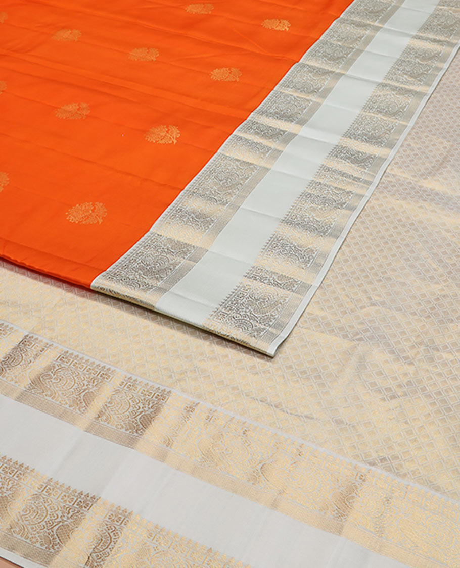 Orange zari buttas silk saree, contrast rettai pettu border of thilakam mokku, kamalam, and mayil designs, and jaal pallu