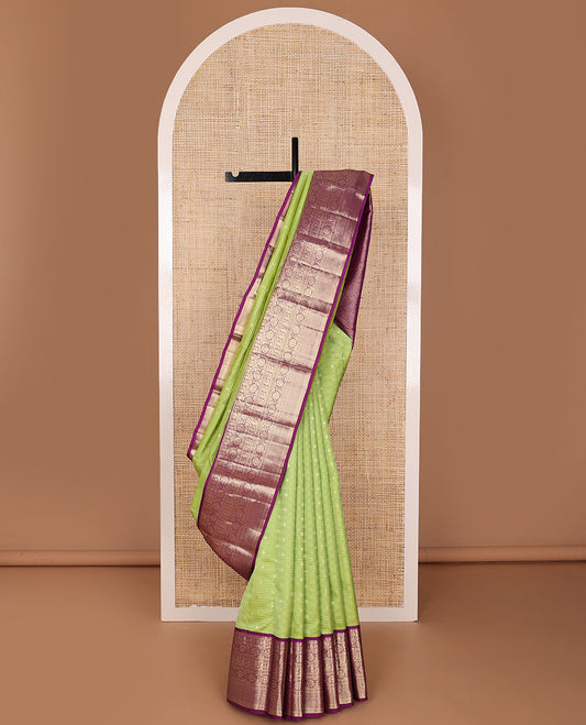 Parrot green zari designs silk saree, contrast ogee patterned pallu & border of thilakam mokku,kamalam,mayil, kodi visiry & mayil kann