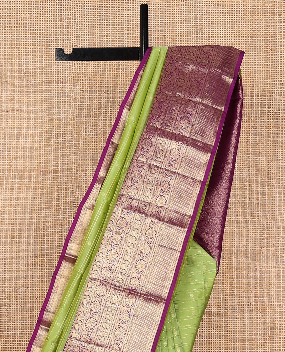 Parrot green zari designs silk saree, contrast ogee patterned pallu & border of thilakam mokku,kamalam,mayil, kodi visiry & mayil kann