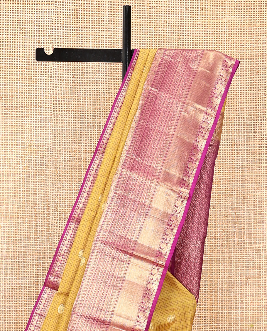 Yellow Vasundhara Silk Saree, Sparsely Sparkled with Zari Buttas and Checks, Complemented by a Contrast Border of Lavangam, Muthu, Kathir, Neli, and Mayil, Jaal Pallu, and a Contrast Blouse