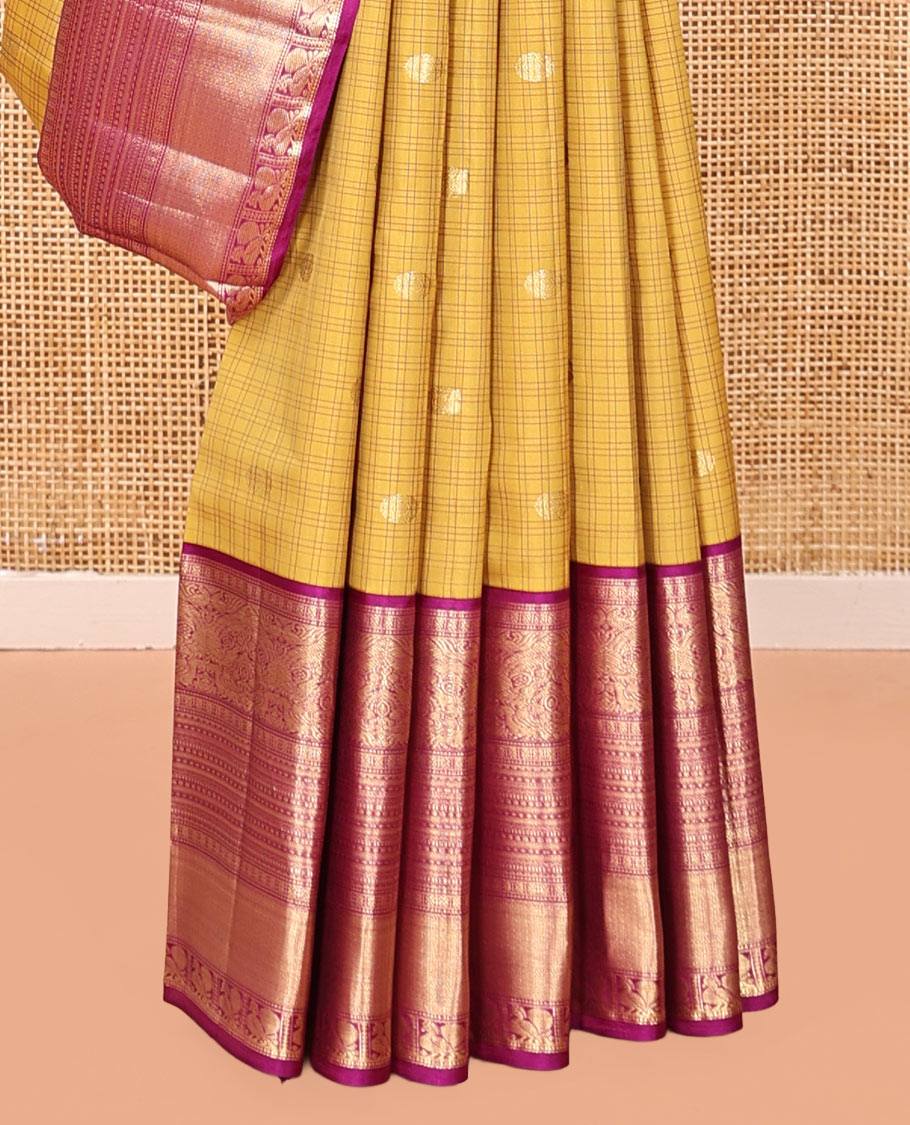 Yellow Vasundhara Silk Saree, Sparsely Sparkled with Zari Buttas and Checks, Complemented by a Contrast Border of Lavangam, Muthu, Kathir, Neli, and Mayil, Jaal Pallu, and a Contrast Blouse