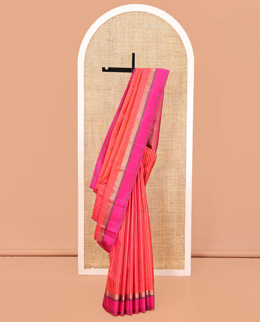 Orange Zari Striped Vasundhara Silk Saree, Contrast Kal Eragina Border of Neli, Muthu, Cross Kamalam Designs, Grand Pallu, and a Contrast Blouse