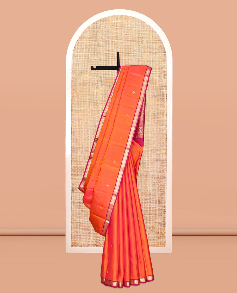 Orange Vasundhara Silk Saree, Embellished with Zari Buttas, Contrast Border of Thilakam Mokku, Vanki, and Diamond Designs, Grand Pallu, and a Contrast Blouse