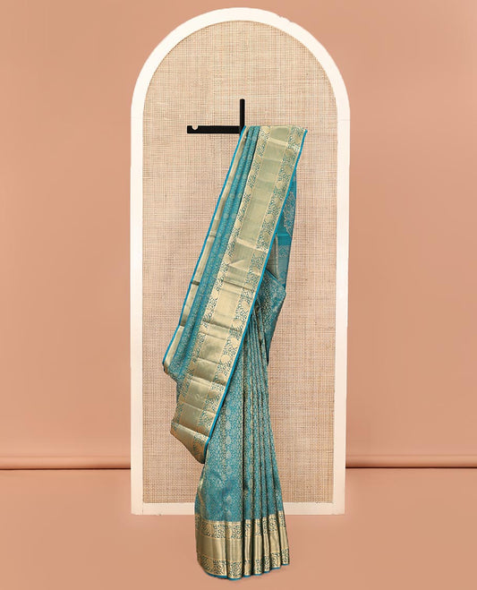 Blue Kanchipuram Wedding Silk Saree, Ornamented with Jacquard Designs on Its Body, Highlighted by a Zari Border of Kodi Visiry and Then Kuli Kann Designs, Pallu of Floral Designs, and Paired with a Matching Blouse