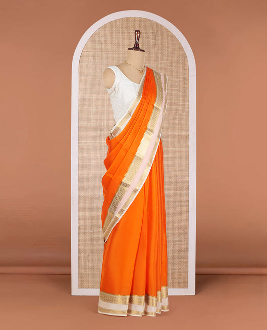 Orange Plain Mysore Silk Saree, Complemented by a Contrast Temple Border of Jaal Designs, Pallu Steeped with Zari Stripes, and Paired with a Contrast Blouse