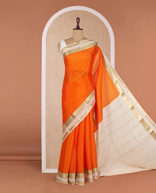 Orange Plain Mysore Silk Saree, Complemented by a Contrast Temple Border of Jaal Designs, Pallu Steeped with Zari Stripes, and Paired with a Contrast Blouse