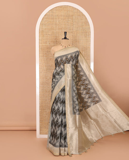 Grey zig-zag style ikkat design with buttas Munga cotton saree, zari jacquard blouse, ogee patterned pallu, and a contrast border of thread and zari buttas