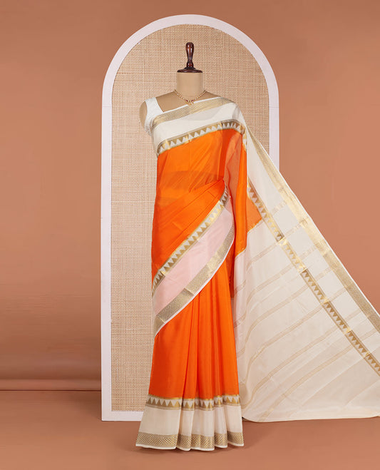Orange Plain Mysore Silk Saree, Gracefully Embellished with a Contrast Temple Border of Jaal Designs, Pallu Steeped with Zari Stripes, and Paired with a Contrast Blouse