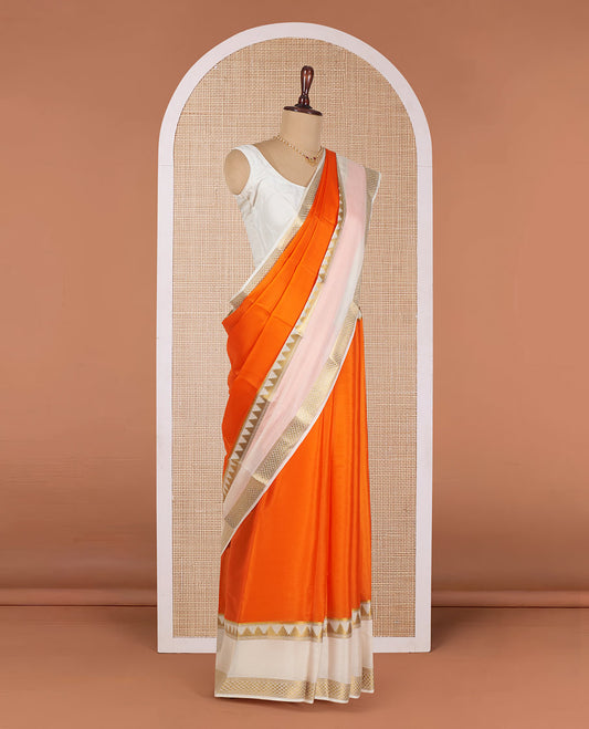 Orange Plain Mysore Silk Saree, Gracefully Embellished with a Contrast Temple Border of Jaal Designs, Pallu Steeped with Zari Stripes, and Paired with a Contrast Blouse