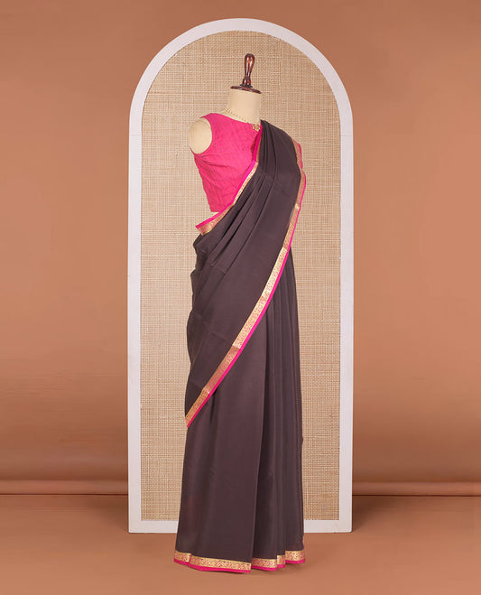 Brown Plain Mysore Silk Saree, Elegantly Highlighted with a Contrast Floral Creeper Border, Pallu Steeped with Zari Stripes, and Paired with a Contrast Blouse