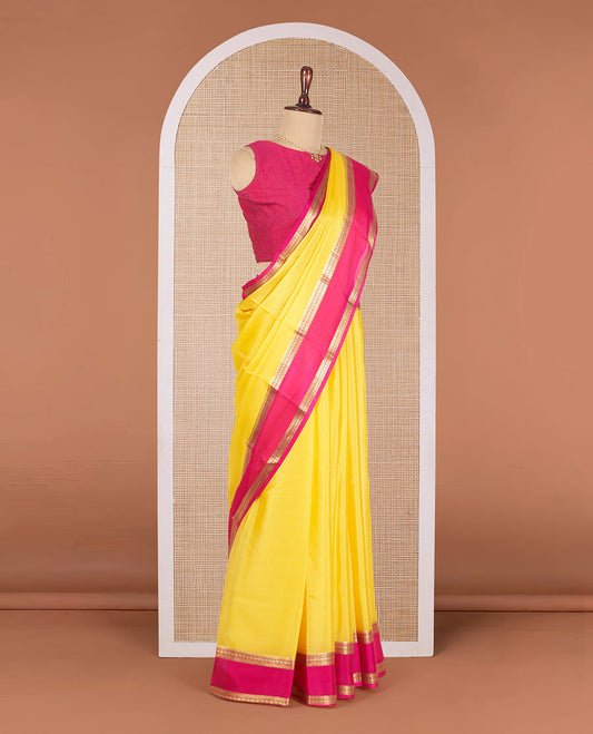 Yellow Plain Mysore Silk Saree, Complemented by a Contrast Traditional Zari Design Border, Pallu Steeped with Zari Stripes, and Paired with a Contrast Blouse