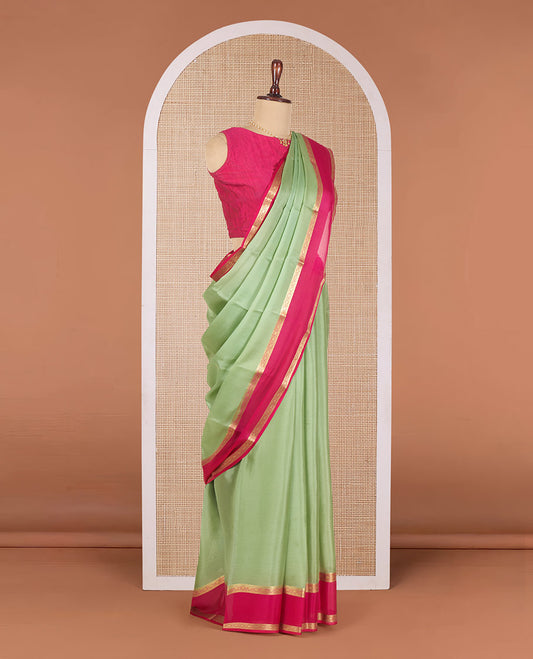 Elaichi Green Plain Mysore Silk Saree, Complemented by a Contrast Traditional Zari Border of Diamond Patterns, Pallu Adorned with Zari Designs, and Paired with a Contrast Blouse