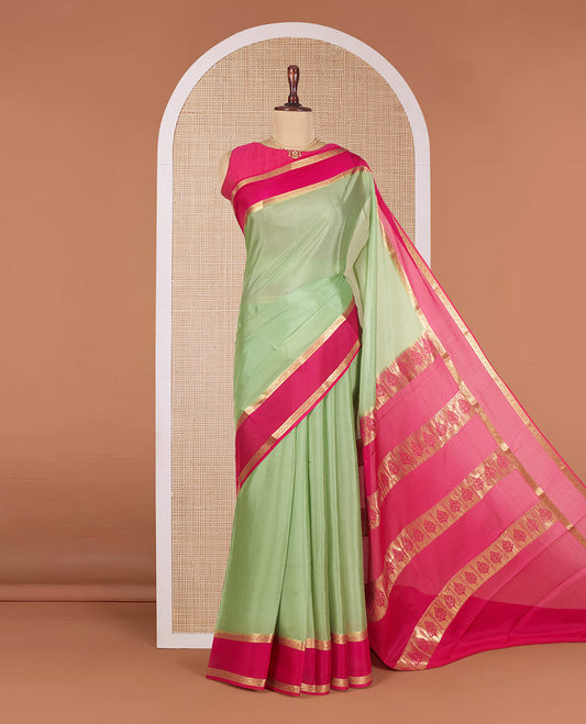 Elaichi Green Plain Mysore Silk Saree, Complemented by a Contrast Traditional Zari Border of Diamond Patterns, Pallu Adorned with Zari Designs, and Paired with a Contrast Blouse