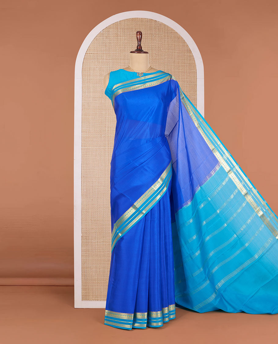 Royal Blue Plain Mysore Silk Saree, Complemented by a Contrast Border Steeped with Traditional Zari Designs, Pallu Featuring Zari Stripes, and Paired with a Contrast Blouse