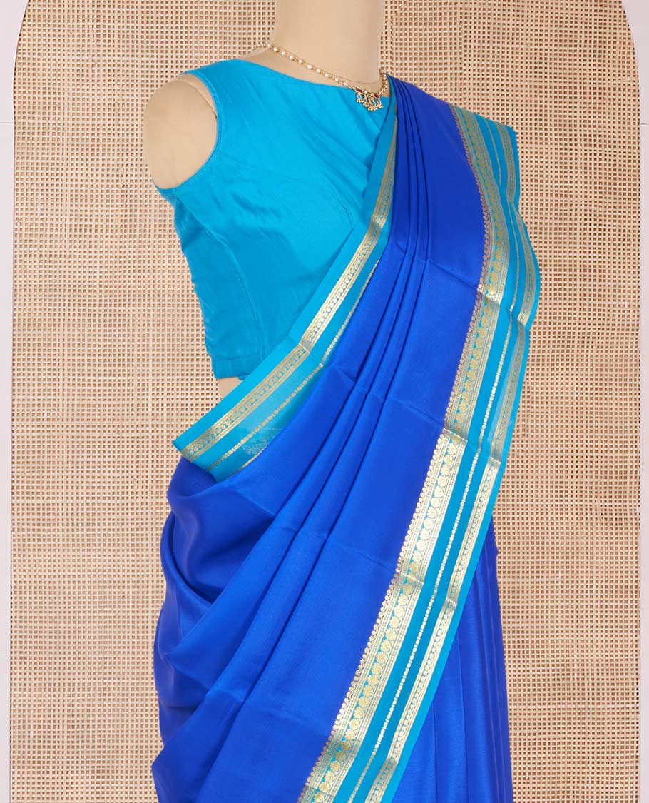 Royal Blue Plain Mysore Silk Saree, Complemented by a Contrast Border Steeped with Traditional Zari Designs, Pallu Featuring Zari Stripes, and Paired with a Contrast Blouse