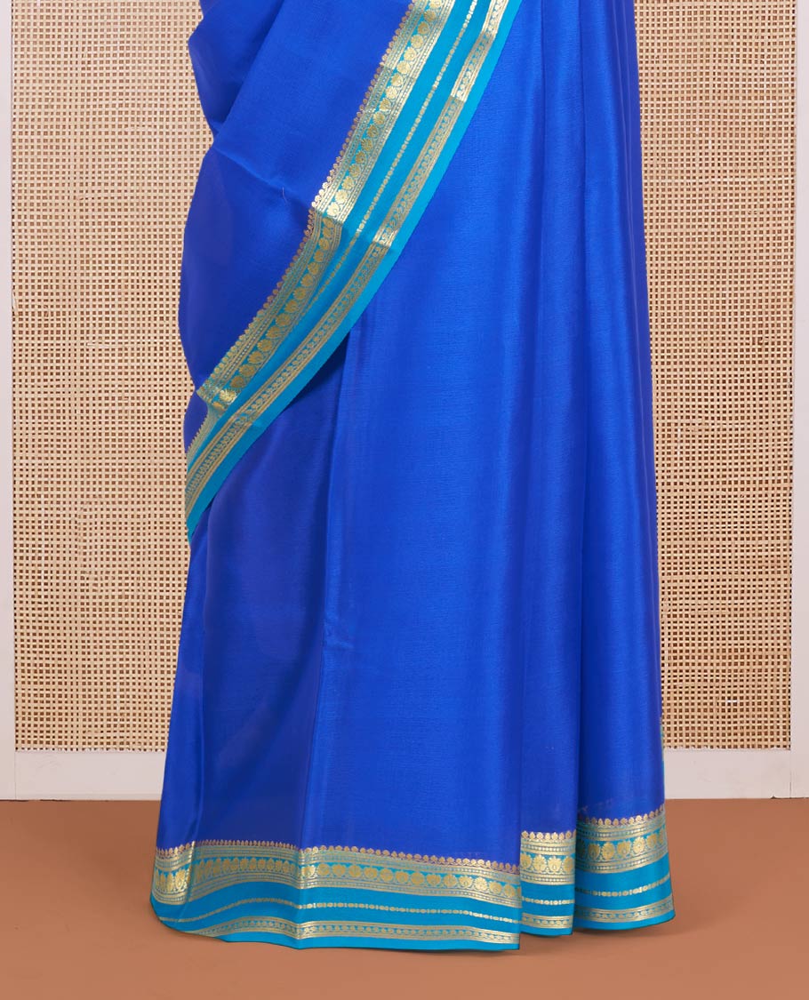 Royal Blue Plain Mysore Silk Saree, Complemented by a Contrast Border Steeped with Traditional Zari Designs, Pallu Featuring Zari Stripes, and Paired with a Contrast Blouse