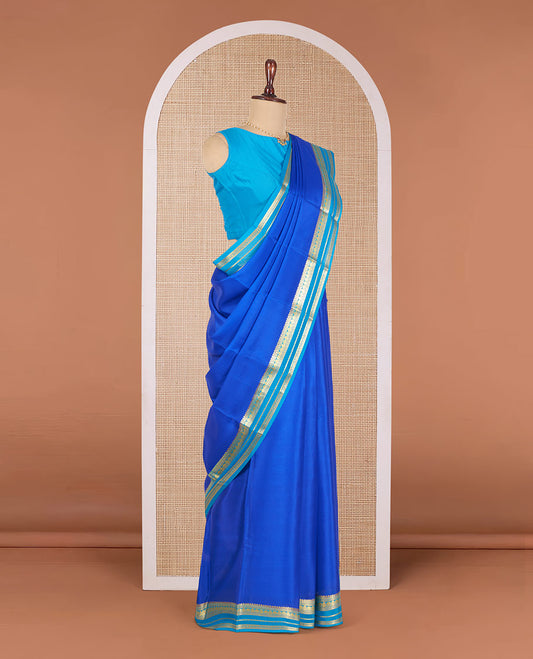Royal Blue Plain Mysore Silk Saree, Complemented by a Contrast Border Steeped with Traditional Zari Designs, Pallu Featuring Zari Stripes, and Paired with a Contrast Blouse