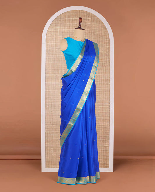 Royal Blue Mysore Silk Saree Accentuated with Zari Buttas All Over the Saree, Complemented by Contrast Border of Paisley Designs, Pallu Steeped with Zari Buttas, and Paired with a Contrast Blouse