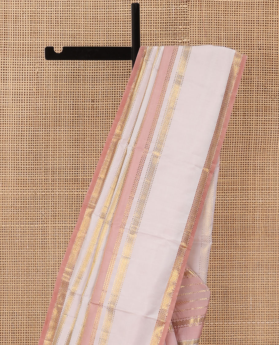 Cream-pink Kanchipuram silk saree features Muthu stripes,mayil kann, and neli designs, rettai pettu mayil kann border, and zari woven pallu