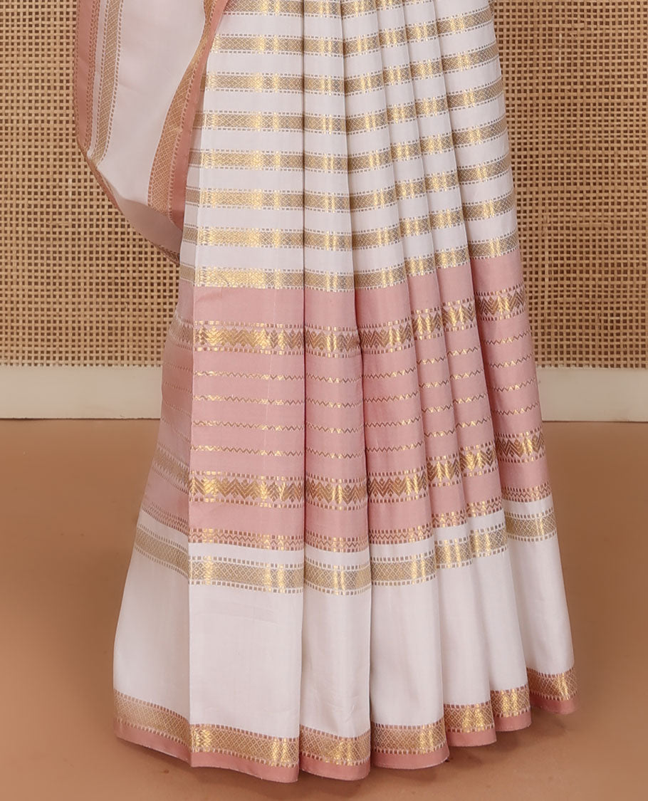 Cream-pink Kanchipuram silk saree features Muthu stripes,mayil kann, and neli designs, rettai pettu mayil kann border, and zari woven pallu